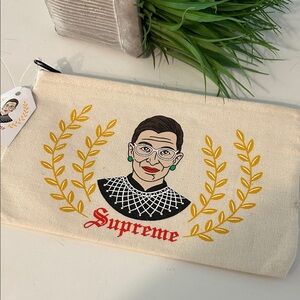 The found RBG cotton Canvas Zip Pouch Cream w/ Gold Laurel hand screen printed